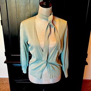 NWT Anne Klein lightweight sweater in sage green. 3/4 sleeve. Snap @ front. Med.